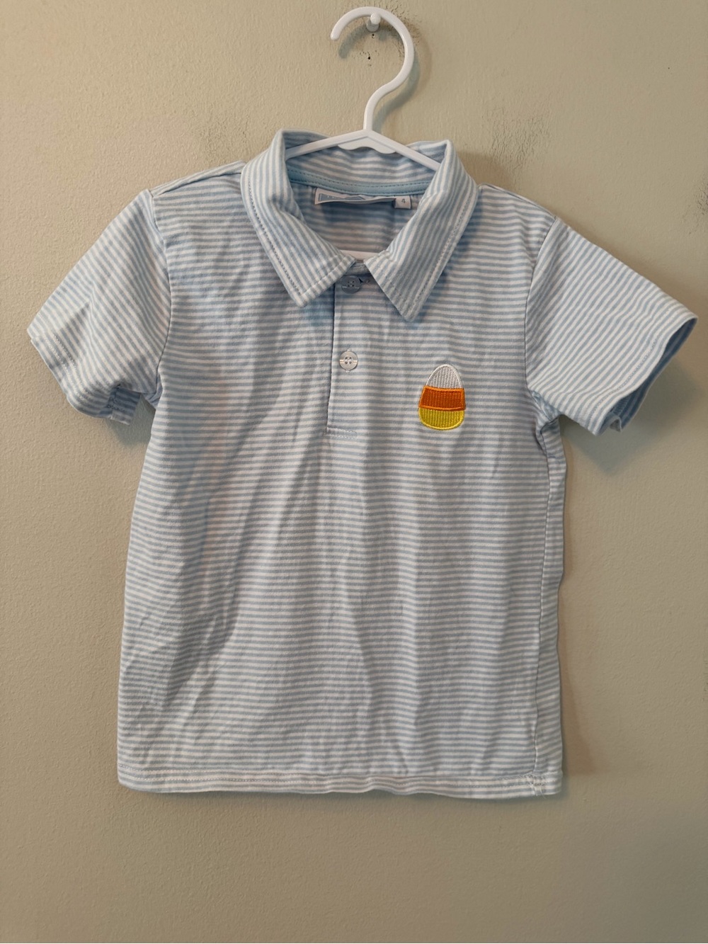 Trotter St. Striped Light Blue Polo Shirt with Candy Corn